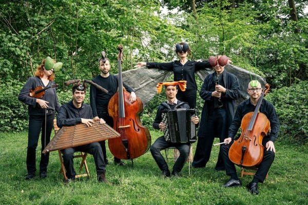 Ensemble Megaphon in park with instruments and insect macs